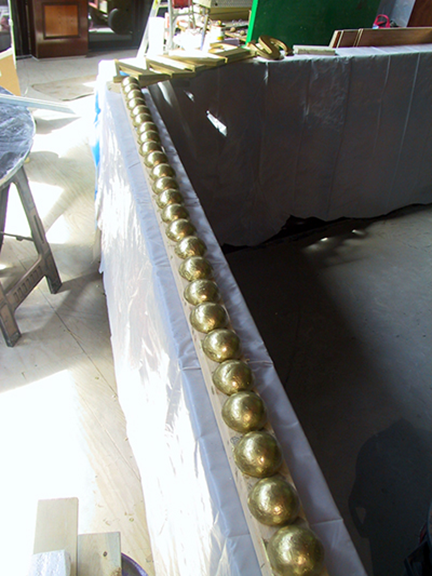 spanish-galleon-reconstruction,-by-john-rivera-resto,-2012,-painting-rounds-and-letters-gold