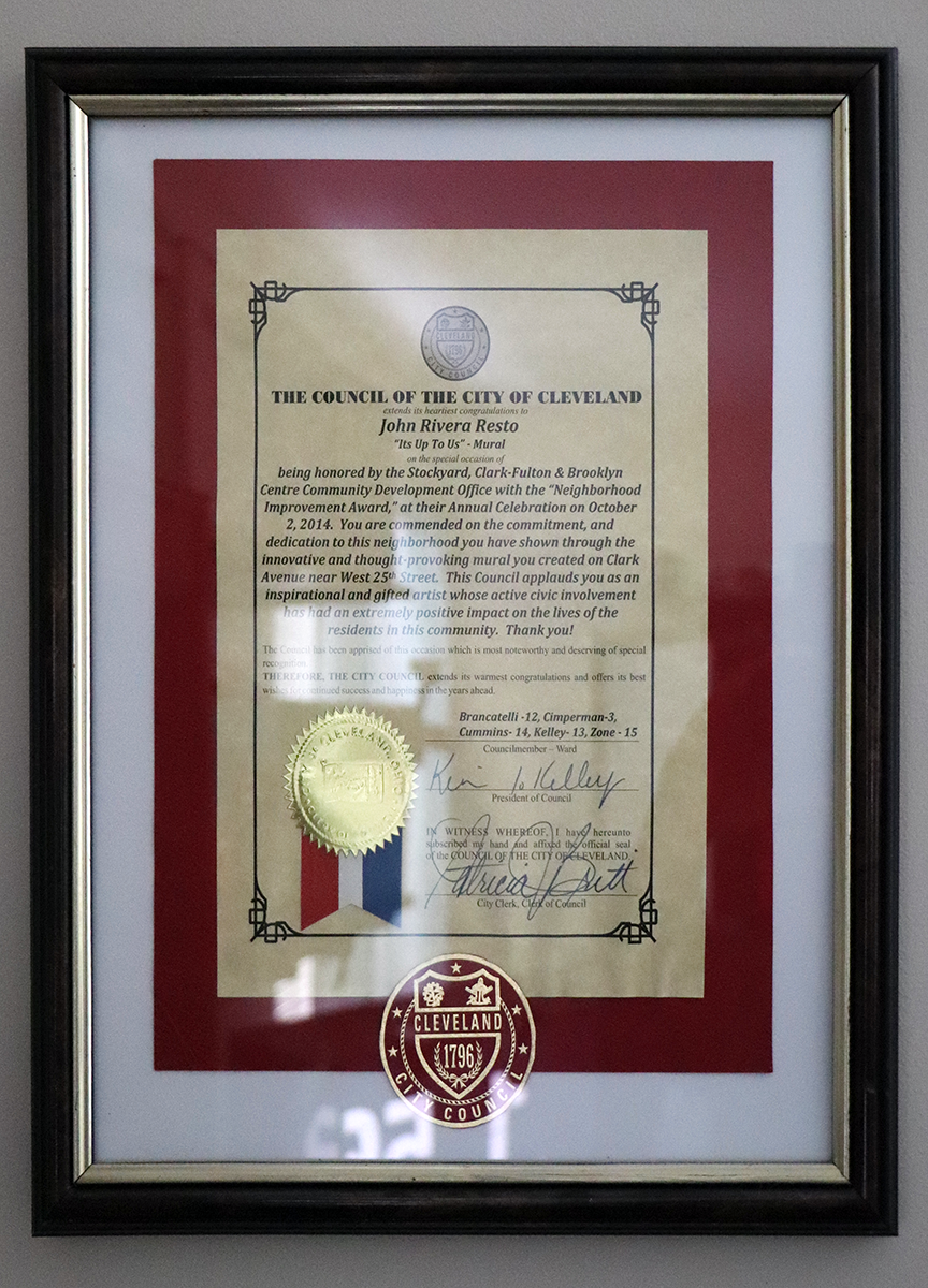 john rivera-resto at the completion of the mural