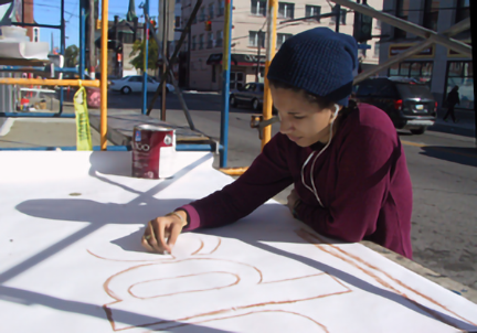 amanda chalking a sign layout