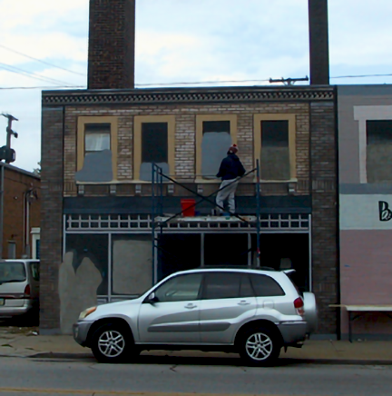 priming upper level windows on building 1