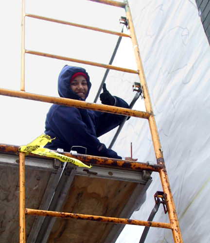 Amanda in good spirits while braving the elements on the scaffold