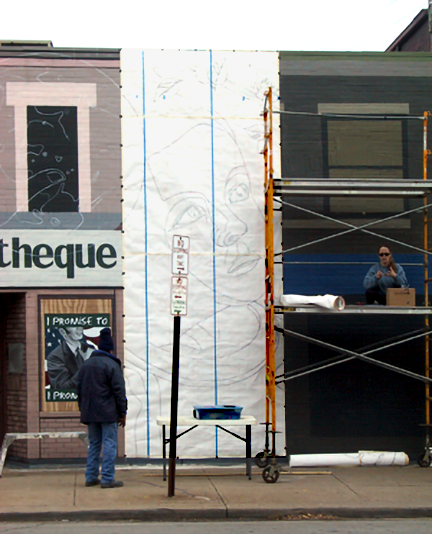 securing a very large paper cartoon on the wall