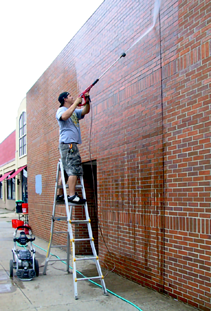 power washing the wall)