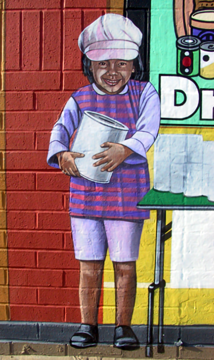 detail of little girl holding donation can