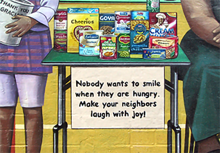 close up view of the food drive sign inscription, that reads: nobody wants to smile when they are hungry.  make your neighbors laugh with joy!